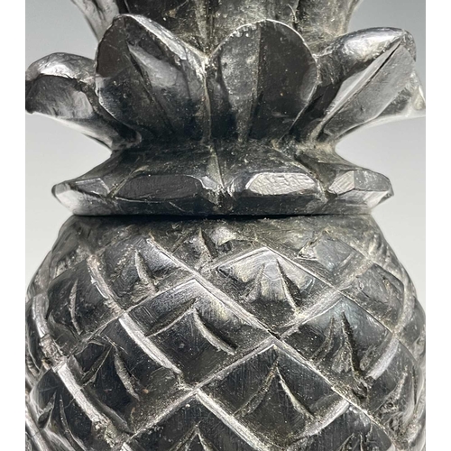 389 - A carved ebony pineapple finial, probably 18th century, height 31cm.