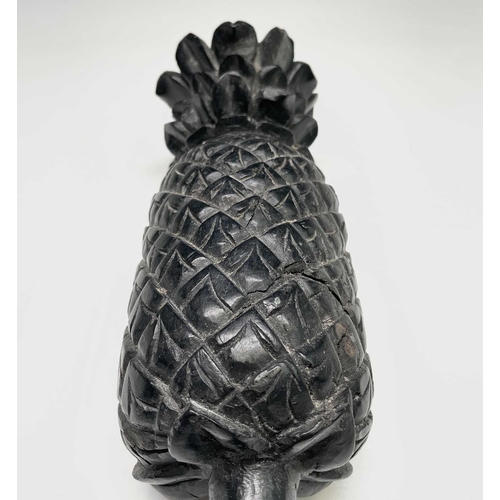 389 - A carved ebony pineapple finial, probably 18th century, height 31cm.