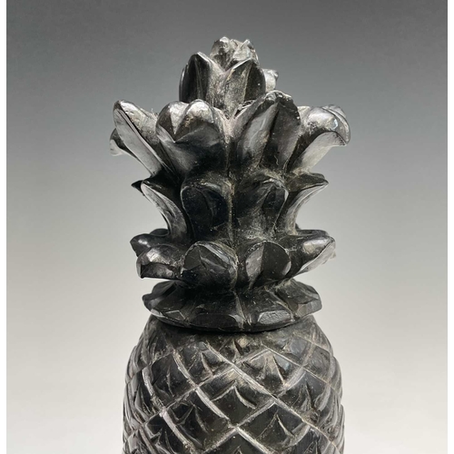 389 - A carved ebony pineapple finial, probably 18th century, height 31cm.