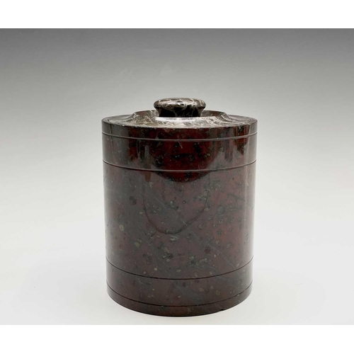 394 - A Cornish serpentine tobacco jar of cylindrical form. Height 14cm.