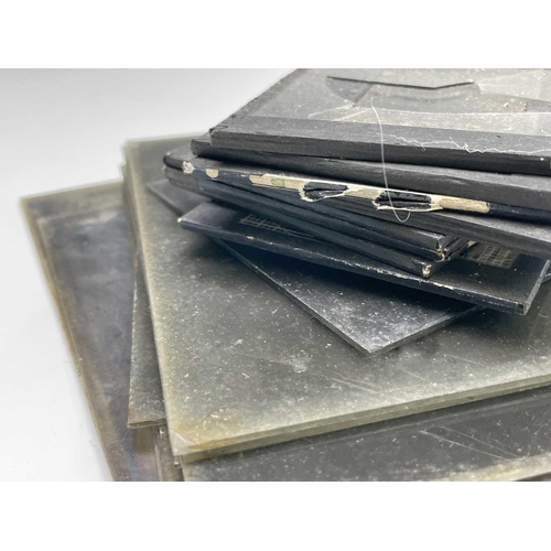 408 - A quantity of Edwardian glass photographic negative plates, including family groups before a Cornish... 