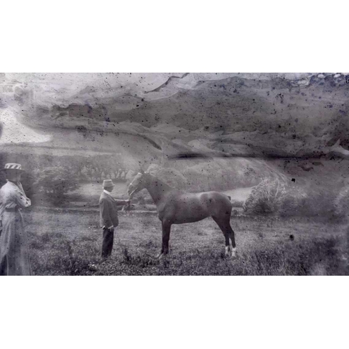 408 - A quantity of Edwardian glass photographic negative plates, including family groups before a Cornish... 