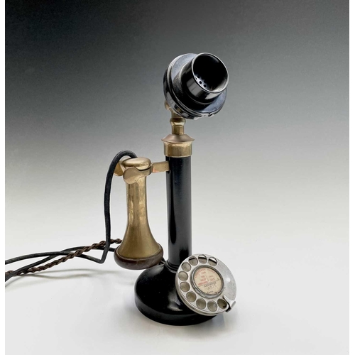 41 - A brass, painted metal and bakelite candlestick telephone, stamped PX150, height 33cm.