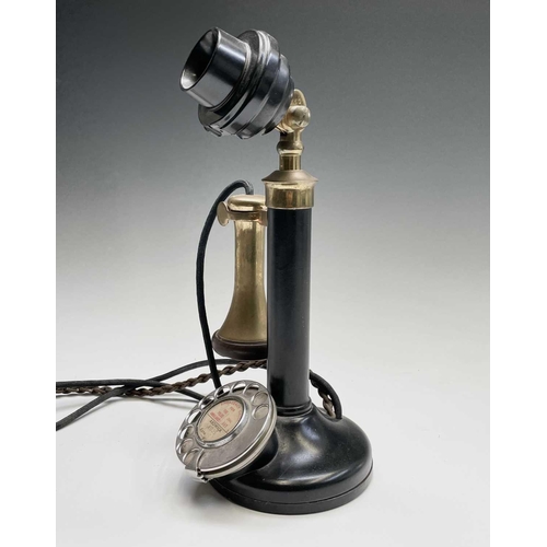 41 - A brass, painted metal and bakelite candlestick telephone, stamped PX150, height 33cm.