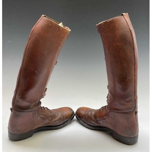 414 - A pair of russet brown gentleman's hobnail boots, possibly military, height 45cm.