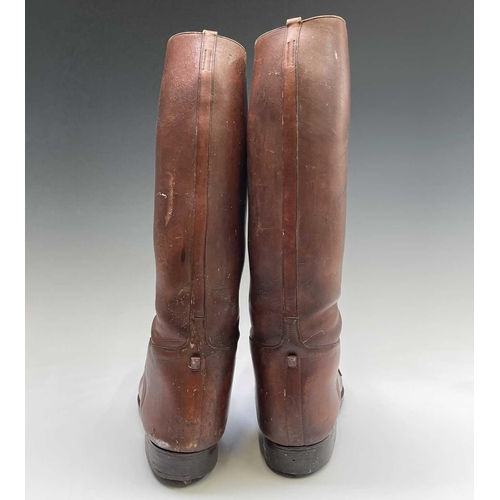 414 - A pair of russet brown gentleman's hobnail boots, possibly military, height 45cm.