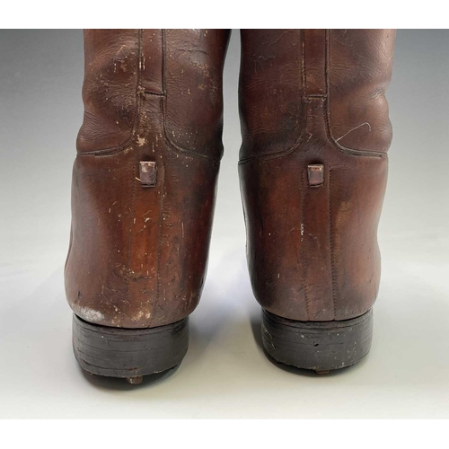 414 - A pair of russet brown gentleman's hobnail boots, possibly military, height 45cm.