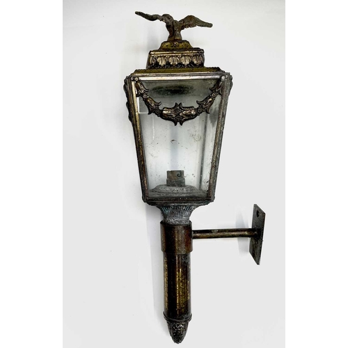 415 - A 19th century brass carriage lamp surmounted by eagle finial. Height 45.5cm.