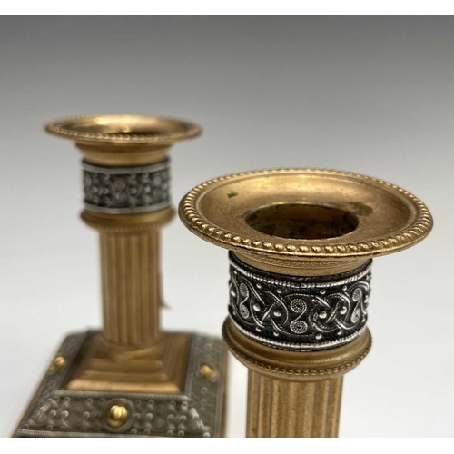 416 - A pair of late 19th/early 20th century Walker & Hall Celtic Revival gilt bronze candlesticks, having... 