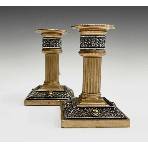 416 - A pair of late 19th/early 20th century Walker & Hall Celtic Revival gilt bronze candlesticks, having... 