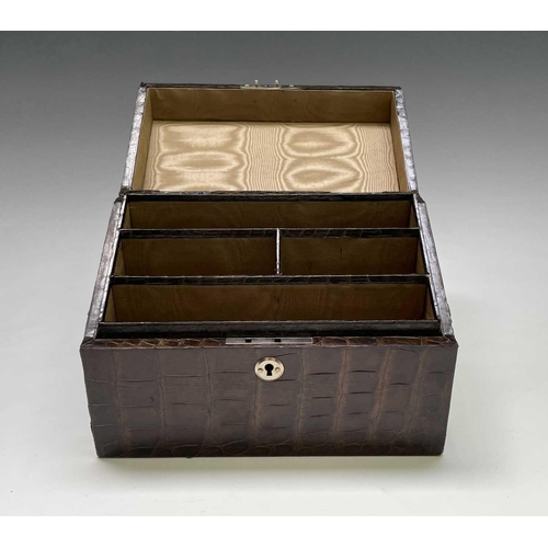 417 - An Asprey crocodile hide covered stationery box with green silk fitted interior. Maximum height 17cm... 