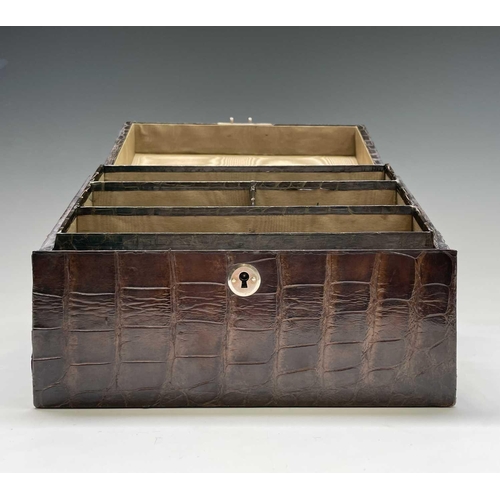 417 - An Asprey crocodile hide covered stationery box with green silk fitted interior. Maximum height 17cm... 