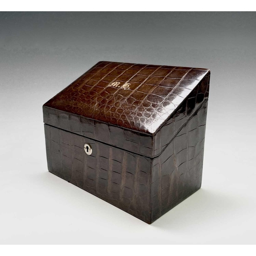 417 - An Asprey crocodile hide covered stationery box with green silk fitted interior. Maximum height 17cm... 