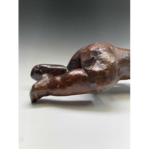 420 - A 17th/18th century Italian hardwood carving of a putto. Length 60cm.