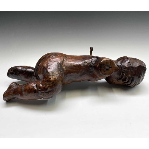 420 - A 17th/18th century Italian hardwood carving of a putto. Length 60cm.