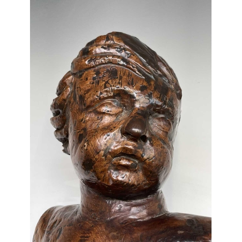 420 - A 17th/18th century Italian hardwood carving of a putto. Length 60cm.