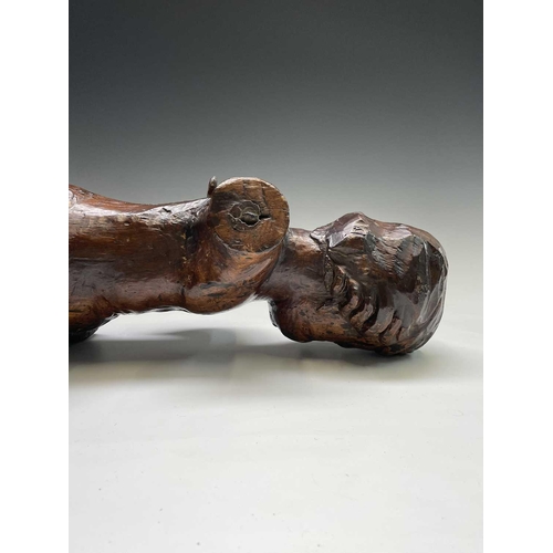 420 - A 17th/18th century Italian hardwood carving of a putto. Length 60cm.