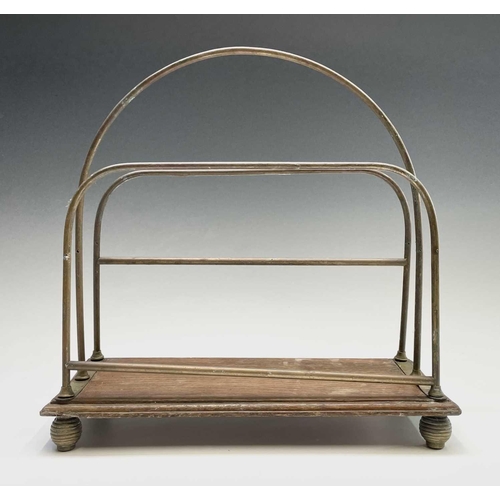 421 - An Edwardian brass and ash magazine rack, width 35.5cm, together with a folding spark guard (2).