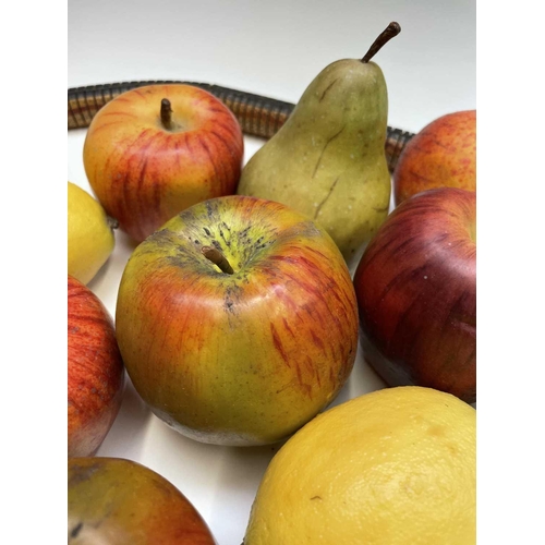 44 - A collection of assorted wax fruit, including apples, bananas, lemons and pears, together with an ar... 