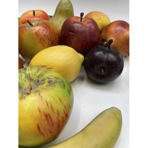 44 - A collection of assorted wax fruit, including apples, bananas, lemons and pears, together with an ar... 