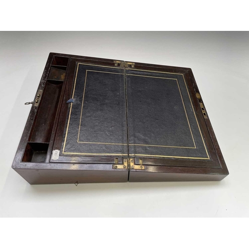 447 - An early Victorian rosewood and cut brass inlaid writing box, with nicely fitted interior with secre... 