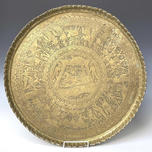 449 - An Indian circular brass tray, engraved with bands of animals and birds, diameter 58cm, together wit... 