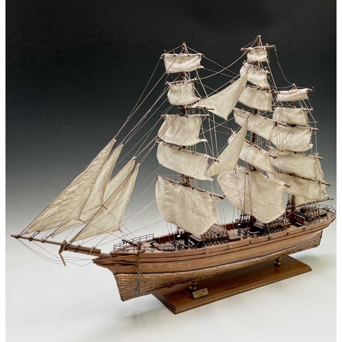 45 - A wooden model of the clipper Cutty Sark, with copper clad hull, titled and mounted on a rectangular... 