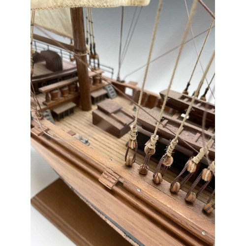 45 - A wooden model of the clipper Cutty Sark, with copper clad hull, titled and mounted on a rectangular... 