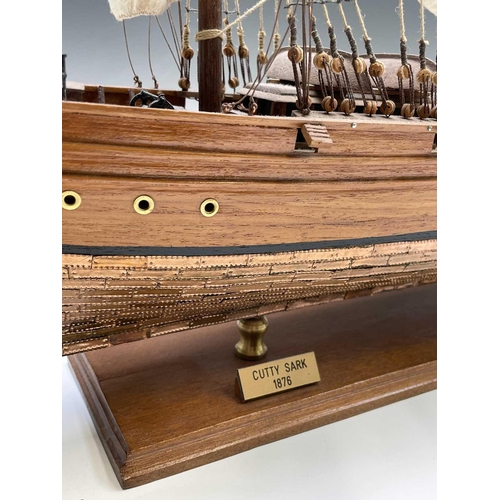 45 - A wooden model of the clipper Cutty Sark, with copper clad hull, titled and mounted on a rectangular... 