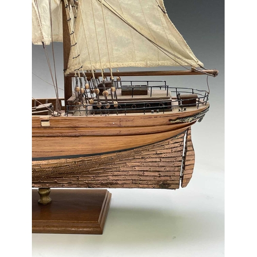 45 - A wooden model of the clipper Cutty Sark, with copper clad hull, titled and mounted on a rectangular... 