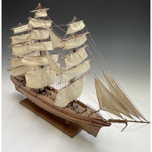 45 - A wooden model of the clipper Cutty Sark, with copper clad hull, titled and mounted on a rectangular... 