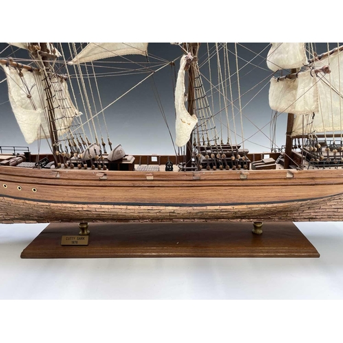 45 - A wooden model of the clipper Cutty Sark, with copper clad hull, titled and mounted on a rectangular... 