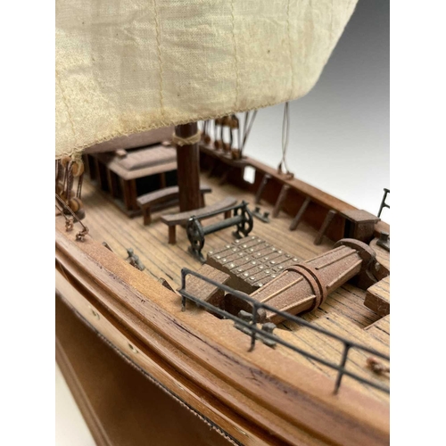 45 - A wooden model of the clipper Cutty Sark, with copper clad hull, titled and mounted on a rectangular... 