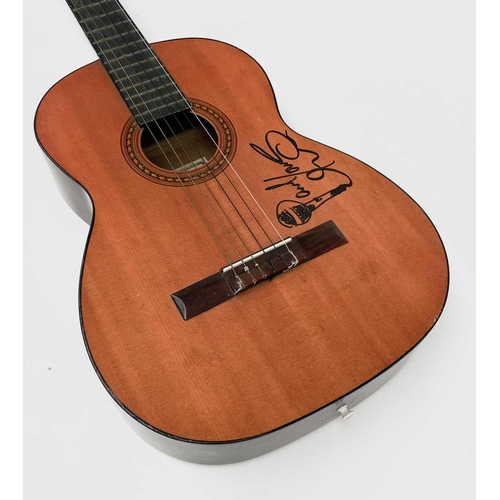 452 - Paul Young, a signed Eros six string guitar, length 99cm. Provenance - the vendor's friend, the stag... 