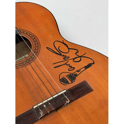 452 - Paul Young, a signed Eros six string guitar, length 99cm. Provenance - the vendor's friend, the stag... 