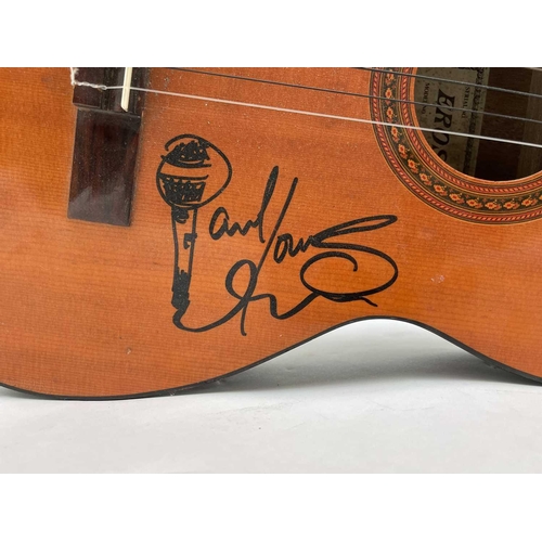 452 - Paul Young, a signed Eros six string guitar, length 99cm. Provenance - the vendor's friend, the stag... 