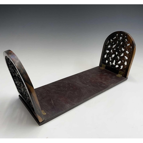 456 - A Victorian carved coromandel and mahogany folding book holder, with carved ends, width 53.5cm.