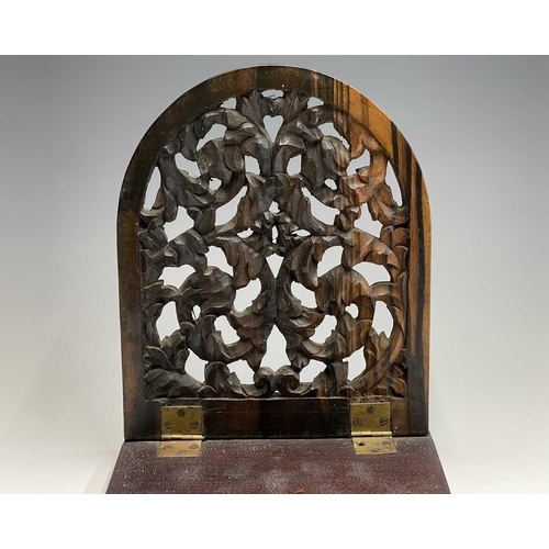 456 - A Victorian carved coromandel and mahogany folding book holder, with carved ends, width 53.5cm.