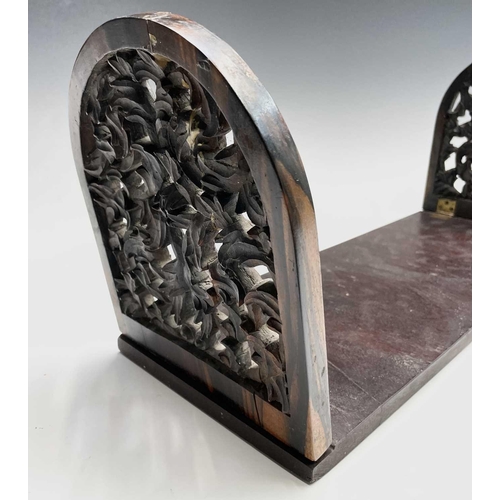 456 - A Victorian carved coromandel and mahogany folding book holder, with carved ends, width 53.5cm.