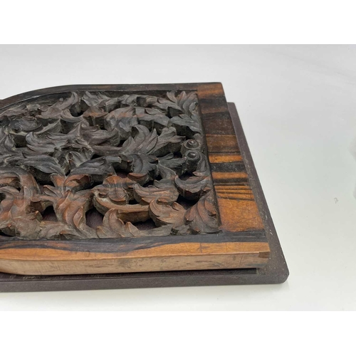 456 - A Victorian carved coromandel and mahogany folding book holder, with carved ends, width 53.5cm.