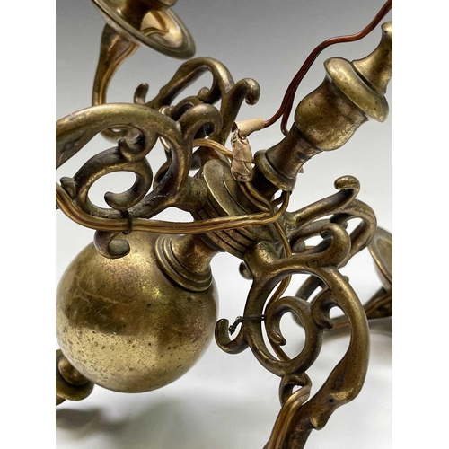 472 - A Dutch brass four branch chandelier, early 19th century, height 29cm, width 27cm.