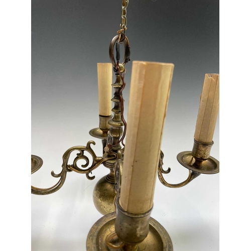 472 - A Dutch brass four branch chandelier, early 19th century, height 29cm, width 27cm.