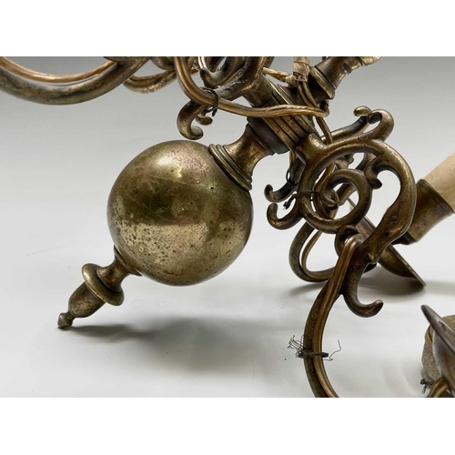 472 - A Dutch brass four branch chandelier, early 19th century, height 29cm, width 27cm.