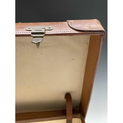 474 - A tan leather suitcase, stamped John Pound & Co, Oxford street, width 63cm.