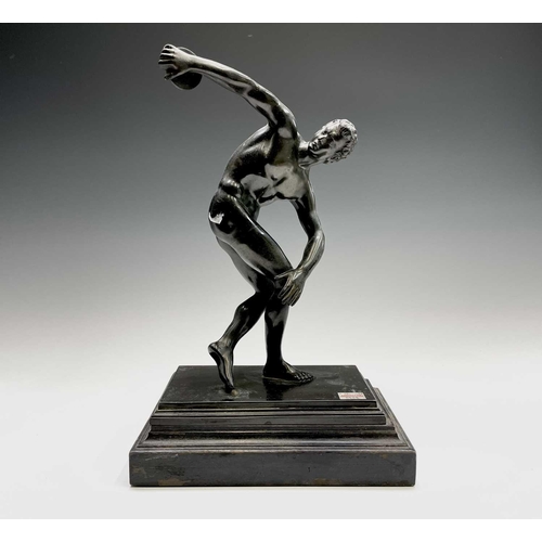 49 - After the Antique, a spelter figure of the discus thrower, 20th century, raised on a stepped ebonise... 