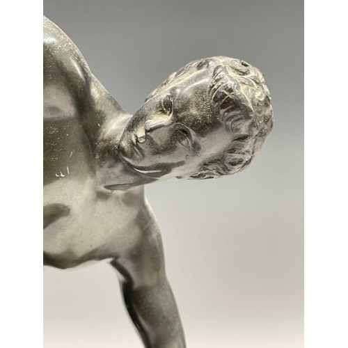 49 - After the Antique, a spelter figure of the discus thrower, 20th century, raised on a stepped ebonise... 