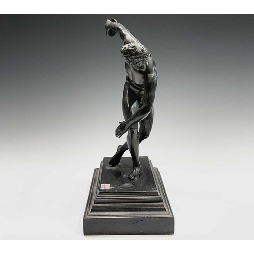 49 - After the Antique, a spelter figure of the discus thrower, 20th century, raised on a stepped ebonise... 