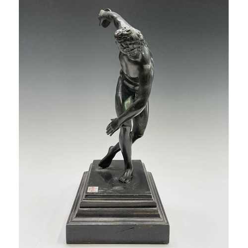 49 - After the Antique, a spelter figure of the discus thrower, 20th century, raised on a stepped ebonise... 