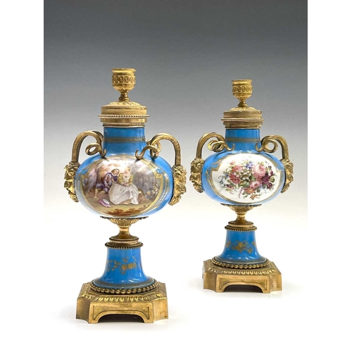 5 - A pair of French 'Sevres' porcelain ormolu mounted cassolettes, late 19th century, with horned mask ... 