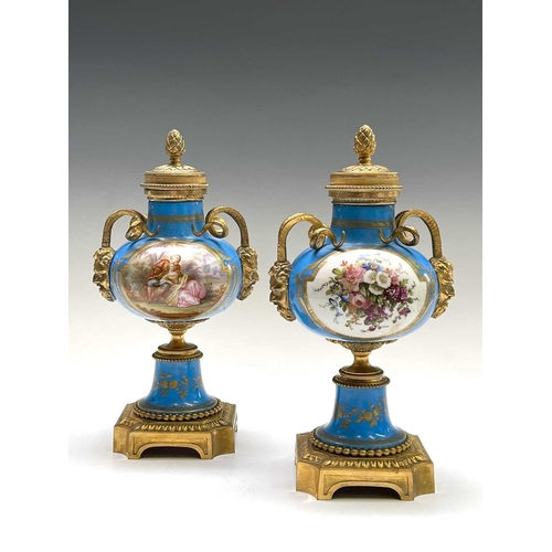 5 - A pair of French 'Sevres' porcelain ormolu mounted cassolettes, late 19th century, with horned mask ... 